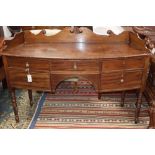 A Regency mahogany bow-fronted sideboard, W.144cm, D.52cm, H.82cmCONDITION: The top is ring marked