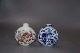 A Chinese blue and white snuff bottle and an underglazed copper snuff bottle, tallest