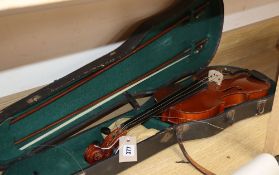 A 20th century Antonius Stradivarius Cremonensis violin, cased with two bows