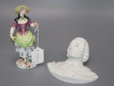 A Meissen style figure of a lady, height 19cm, and a biscuit bust of Shakespeare,