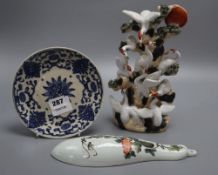 A Chinese blue and white dish, a wall pocket and a bird group, tallest 26cm
