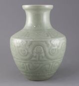 A Chinese celadon glazed archaistic moulded vase, Qianlong underglaze blue seal mark to base,