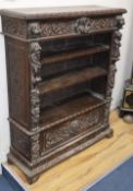 A late Victorian Flemish carved oak open bookcase, W.93cm, D.31cm, H.115cm