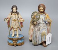 A painted carved wood religious figure of a kneeling saint and a similar painted carved wood and