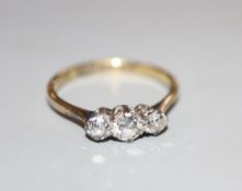 A mid 20th century 18ct and plat, three stone diamond ring, size N, gross 2.3 grams.CONDITION: