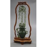 A jade vase on stand