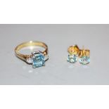 A modern 14k, aquamarine and diamond set three stone ring, size P, gross 3.5 grams and a pair of 14k