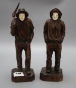 Two carved wood figures of workmen, with ivory faces, signed Neri, height 31cm