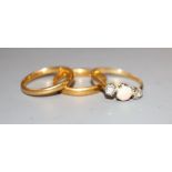 Two 22ct gold wedding bands, 6.6 grams and a yellow metal, white opal and diamond set three stone