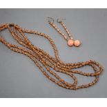 A triple strand split coral bead necklace with paste spacers and rose cut diamond set 18ct clasp,