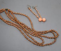 A triple strand split coral bead necklace with paste spacers and rose cut diamond set 18ct clasp,