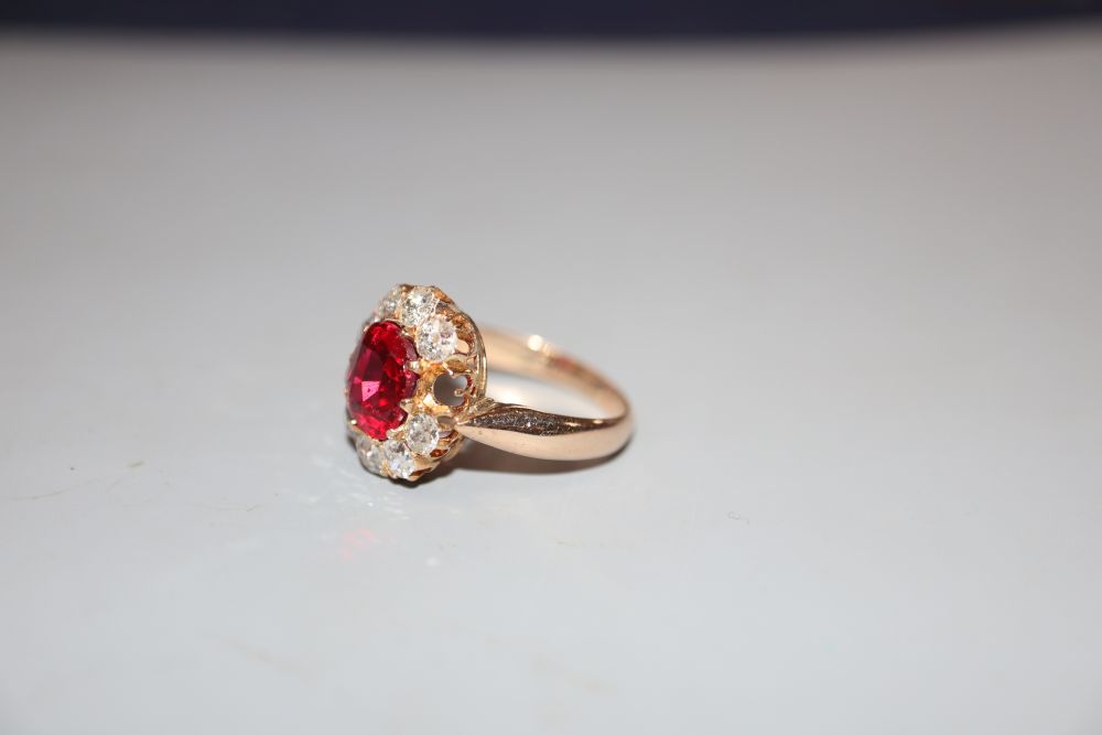 An early-mid 20th century yellow metal, red doublet and diamond set oval cluster ring, size K, gross - Image 2 of 3