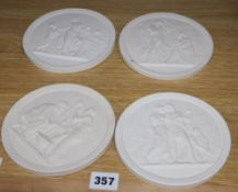 A set of four classical plaster wall plaques, diameter 13.5cm