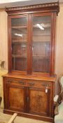 A late Victorian mahogany bookcase cupboard, W.118cm D.50cm H.240cm