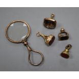 A 9ct mounted smoky quartz fob seal, 28mm, two yellow metal overlaid fob seals, a gilt fob seal