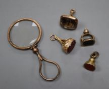 A 9ct mounted smoky quartz fob seal, 28mm, two yellow metal overlaid fob seals, a gilt fob seal