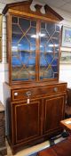 A George III and later mahogany, satinwood banded bookcase cabinet, W.107cm, D.51cm, H.