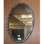 An Irish style oval mirror, W.42cm, H.62cm