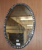 An Irish style oval mirror, W.42cm, H.62cm