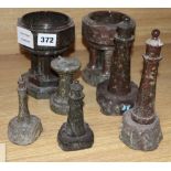 Cornish serpentine models of two fonts, four lighthouses and a sundial, tallest 18cm