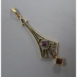 An Edwardian Arts & Crafts 15ct and two stone amethyst? set drop pendant, overall 52mm, gross 2.5