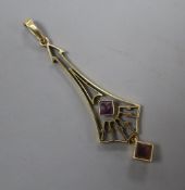 An Edwardian Arts & Crafts 15ct and two stone amethyst? set drop pendant, overall 52mm, gross 2.5