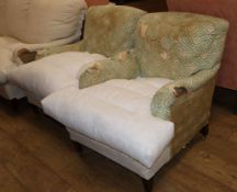 A pair of Howard & Sons upholstered armchairs, W.70cm D.100cm H.82cmCONDITION: This will need