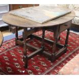 An 18th century oak oval topped gateleg dining table, 150cm extended, W.100cm, H.68cm