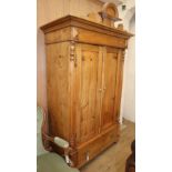 A small 19th century Continental pine armoire, W.120cm D.68cm H.214cmCONDITION: It has been re-