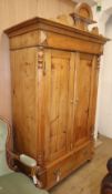 A small 19th century Continental pine armoire, W.120cm D.68cm H.214cmCONDITION: It has been re-