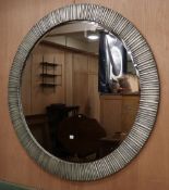 A large modern circular silvered metal wall mirror, Diameter 136cm