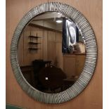 A large modern circular silvered metal wall mirror, Diameter 136cm