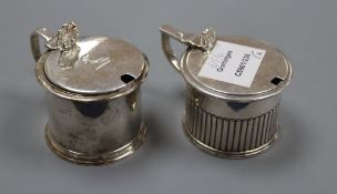 Two 19th century silver drum mustards, with blue glass liners. London, 1826 and London, 1853,