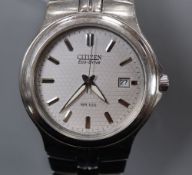 A gentleman's modern stainless steel Citizen Eco-Drive wrist watch, with baton numerals and date