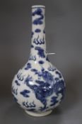 A Chinese blue and white dragon bottle vase, with Kangxi mark, height 32cmCONDITION: Typical minor