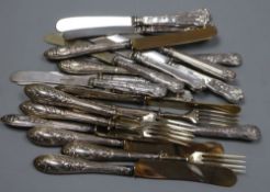 Five pairs of Persian white metal handles fruit knives & forks and twelve silver handled cake