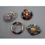 A 1950's Scottish pierced silver and amethyst set oval brooch, two white metal and Scottish