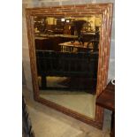 A large bamboo effect wall mirror, with bevelled plate, W.122cm, H.153cm