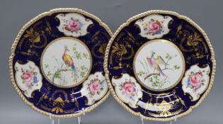 A pair of Royal Crown Derby plates, gilt decorated with birds and flowers, diameter 26cmCONDITION: