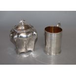 A Victorian engraved silver christening mug, Henry Holland, London, 1870 and an Edwardian silver tea