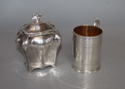 A Victorian engraved silver christening mug, Henry Holland, London, 1870 and an Edwardian silver tea