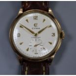 A gentleman's 1950's 9ct gold Cyma manual wind wrist watch, with honeycomb dial and subsidiary