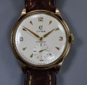 A gentleman's 1950's 9ct gold Cyma manual wind wrist watch, with honeycomb dial and subsidiary