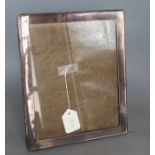 A George V silver mounted rectangular photograph frame, Birmingham, 1921, 21.8cm.CONDITION: A few