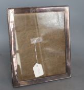 A George V silver mounted rectangular photograph frame, Birmingham, 1921, 21.8cm.CONDITION: A few
