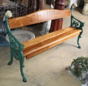 A cast iron and teak garden bench marked Carabas, W.160cm, D.40cm, H.96cm