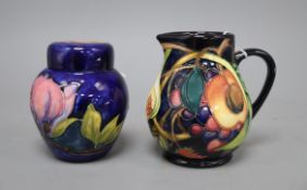 A Moorcroft 'Queen's Choice' blue ground bulbous jug and a Hibiscus ginger jar and cover, tallest