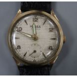 A gentleman's 1950's 9ct gold Majex manual wind wrist watch, on leather strap.CONDITION: Case