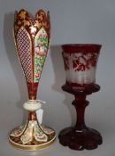 A Bohemian etched ruby glass goblet, together with a gilded cranberry glass vase, tallest