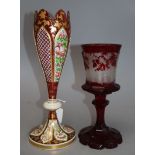 A Bohemian etched ruby glass goblet, together with a gilded cranberry glass vase, tallest